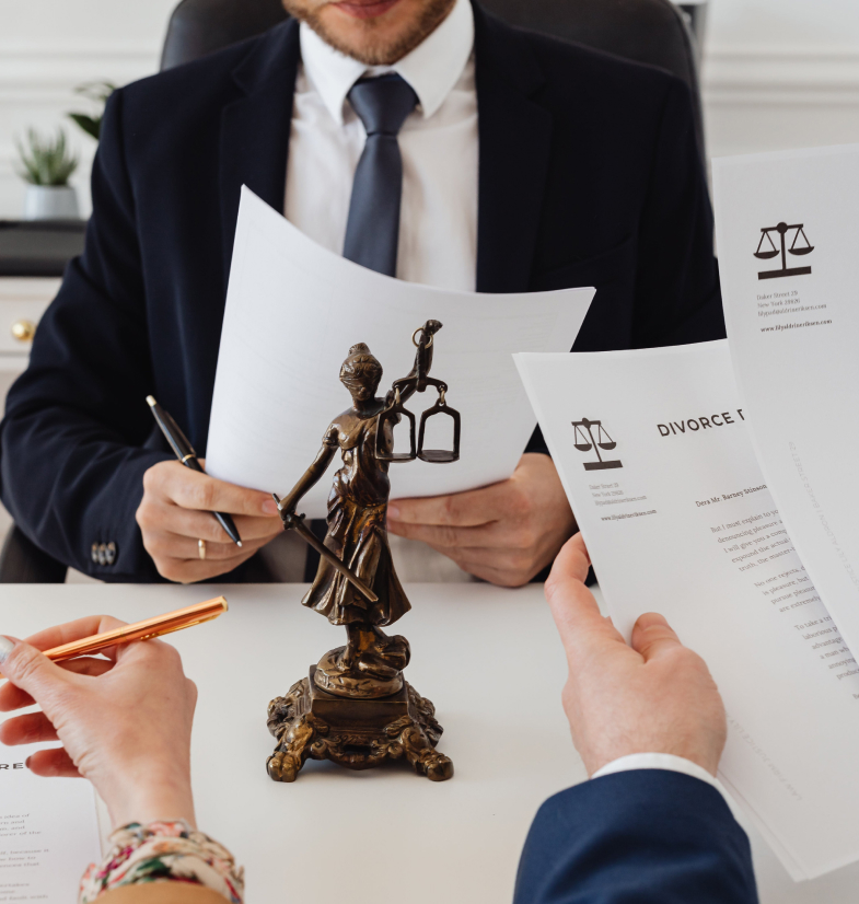 People in an office with Lady Justice